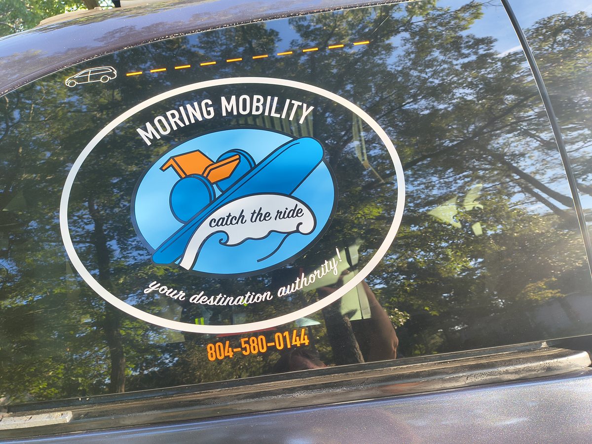 The Moring Mobility LLC logo decal on the vehicle's window